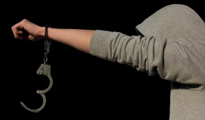 Arrested Criminal in Handcuffs